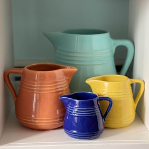 All four sizes of the milk pitchers - the back three were purchased together (and amazingly I didn't have any of these colors in these sizes). The little #427 Pacific Blue example came from Jack Chipman.
